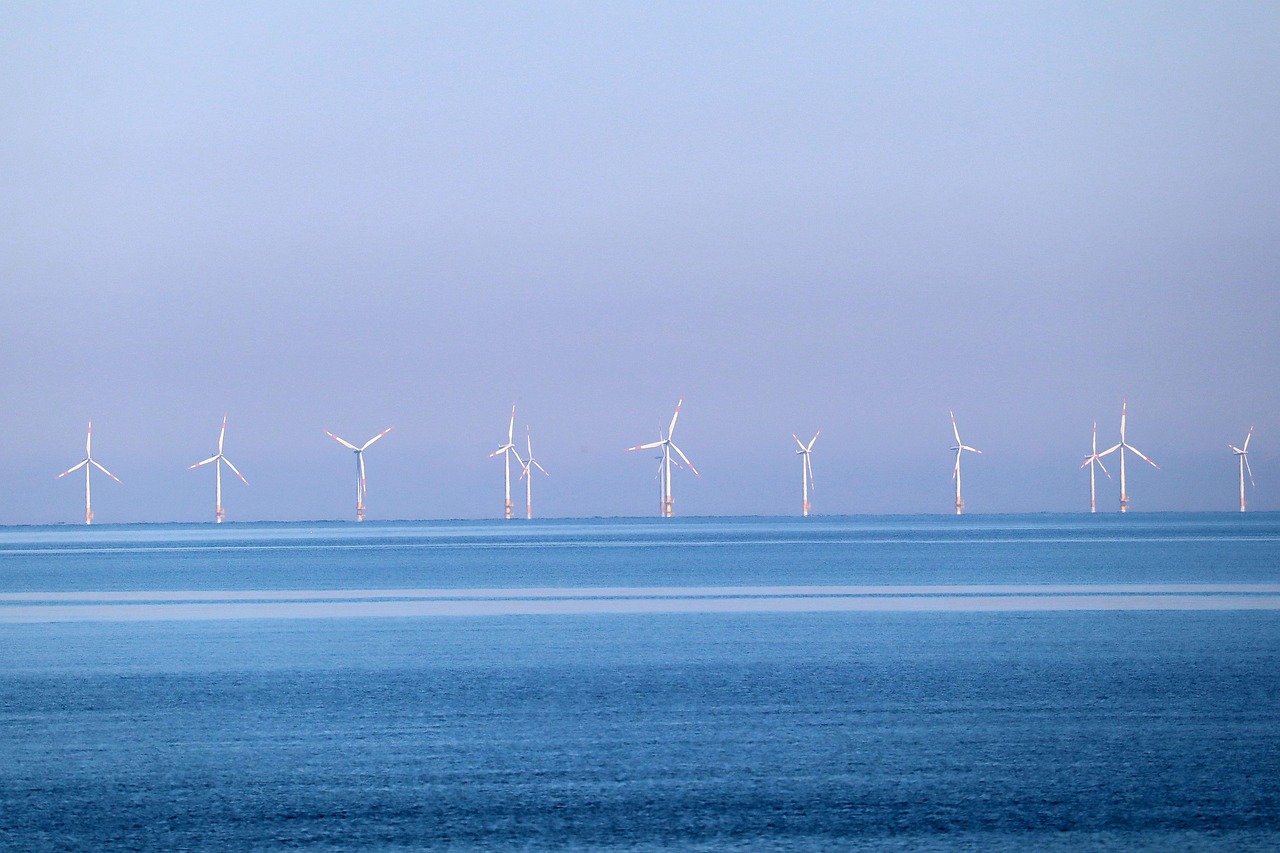 windmill-by-thomas-g Image of a sea windmill farm in pastel colours, pink and blue.